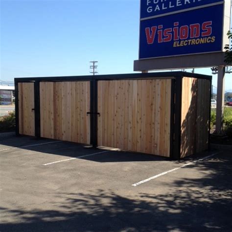 metal bar bolted to ground trash enclosures|trash enclosures for sale.